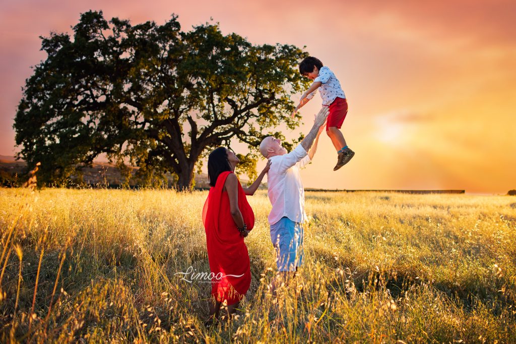 Playful maternity session family photo sunset golden hour