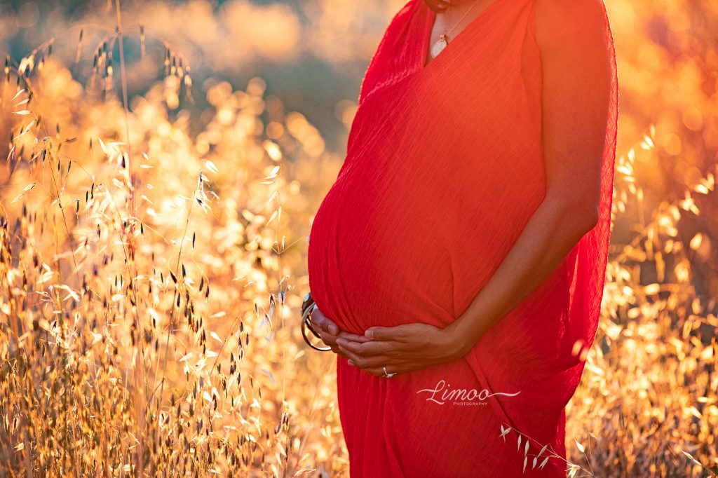Playful maternity session belly photo sunset golden hour